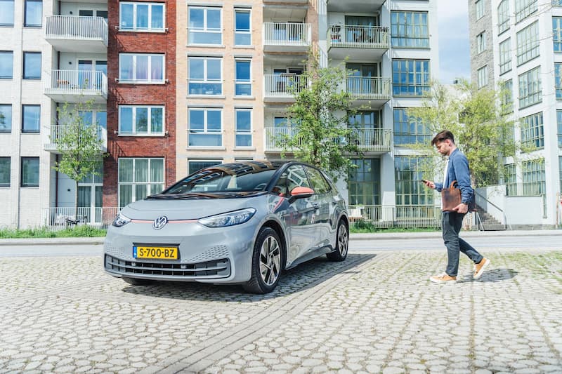 man-walking-towards-grey-car _small